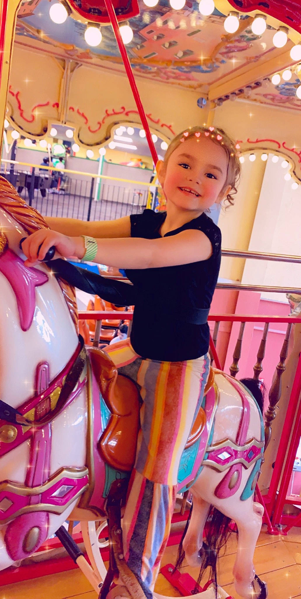 Lilyanna joined the competition — help win amazing prizes! amusement_park, amusement_ride, carousel, fun, joy, nonbuilding_structure, park, person, recreation