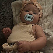 Kristiahnna joined the competition — help win amazing prizes! baby, pacifier, headband, blanket, plaid_skirt, infant, clothing, cute, child, indoors, soft_texture, relaxing, portrait, young_child, sleepwear, cozy, hand, face, person, couch