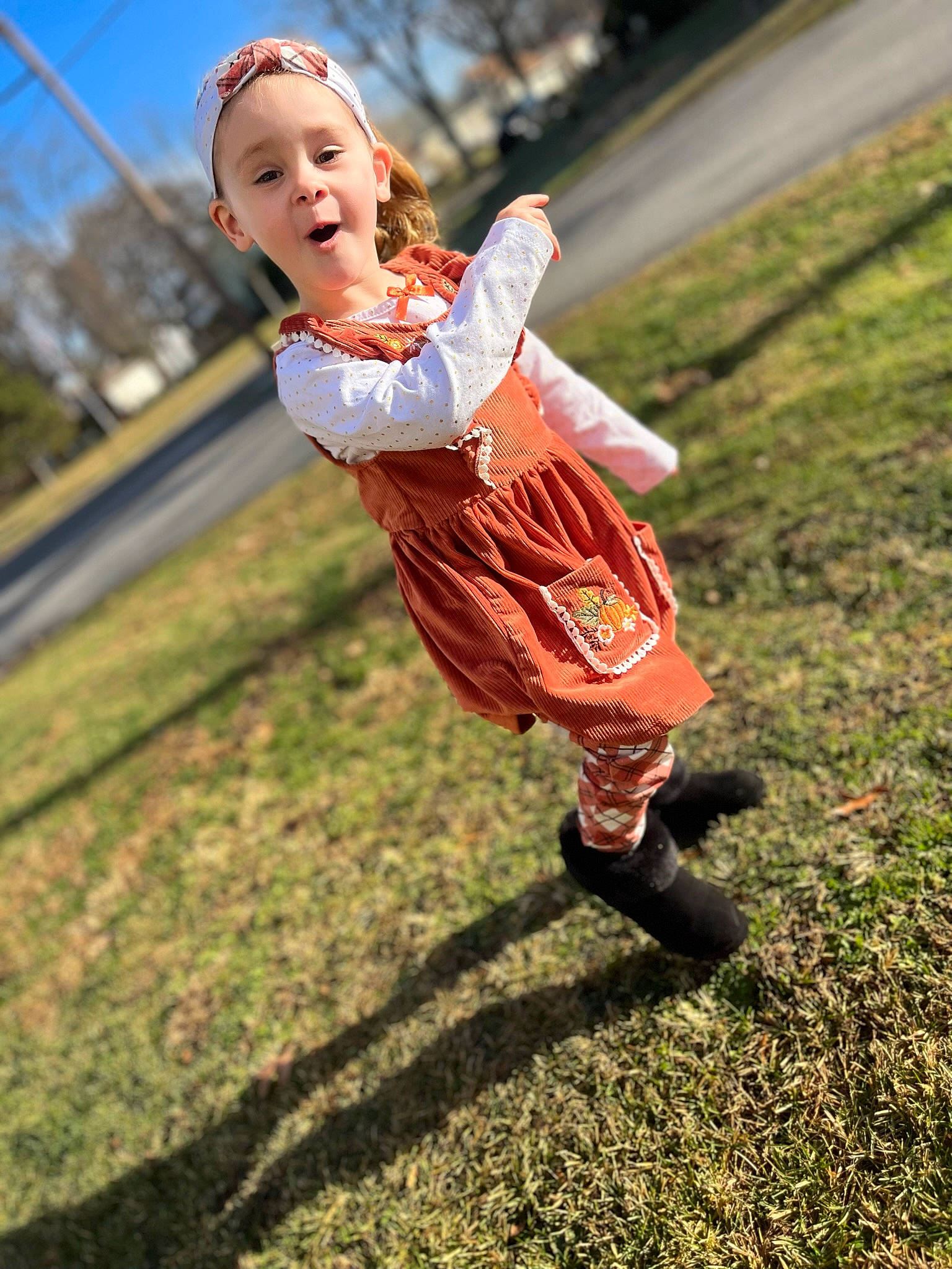 Mckenzie is registered to the contest to win money with this photo: ball, child, exercise, face, flash_photography, fun, grass, happy, human_leg, leisure, people_in_nature, person, portrait_photography, recreation, running, shoe, sitting, sky, smile, soil