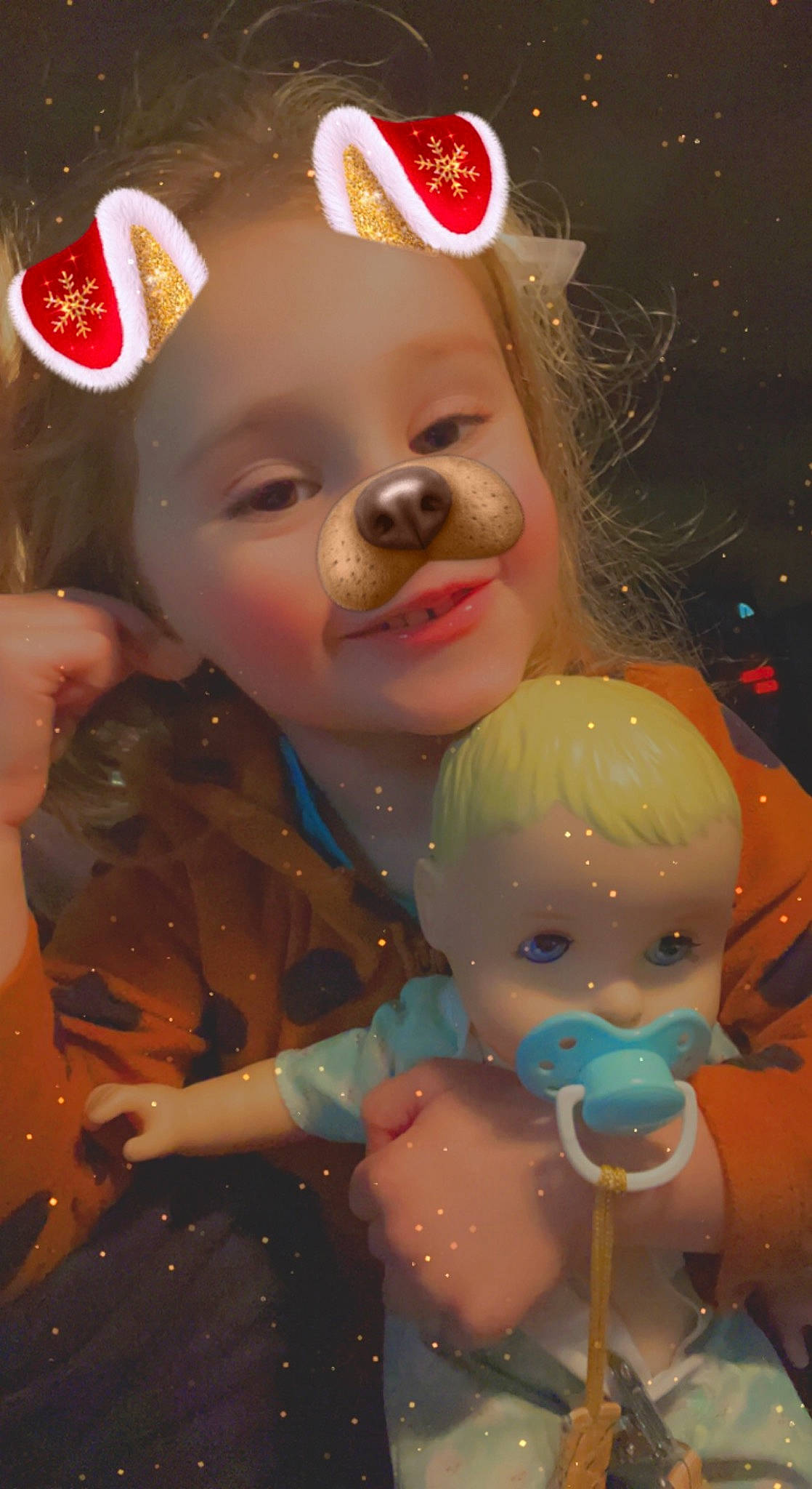 Mckenzie is registered to the contest to win money with this photo: art, baby, cheek, child, christmas, christmas_eve, christmas_ornament, event, face, fun, happy, head, light, lighting, nose, organ, person, pink, skin, toddler