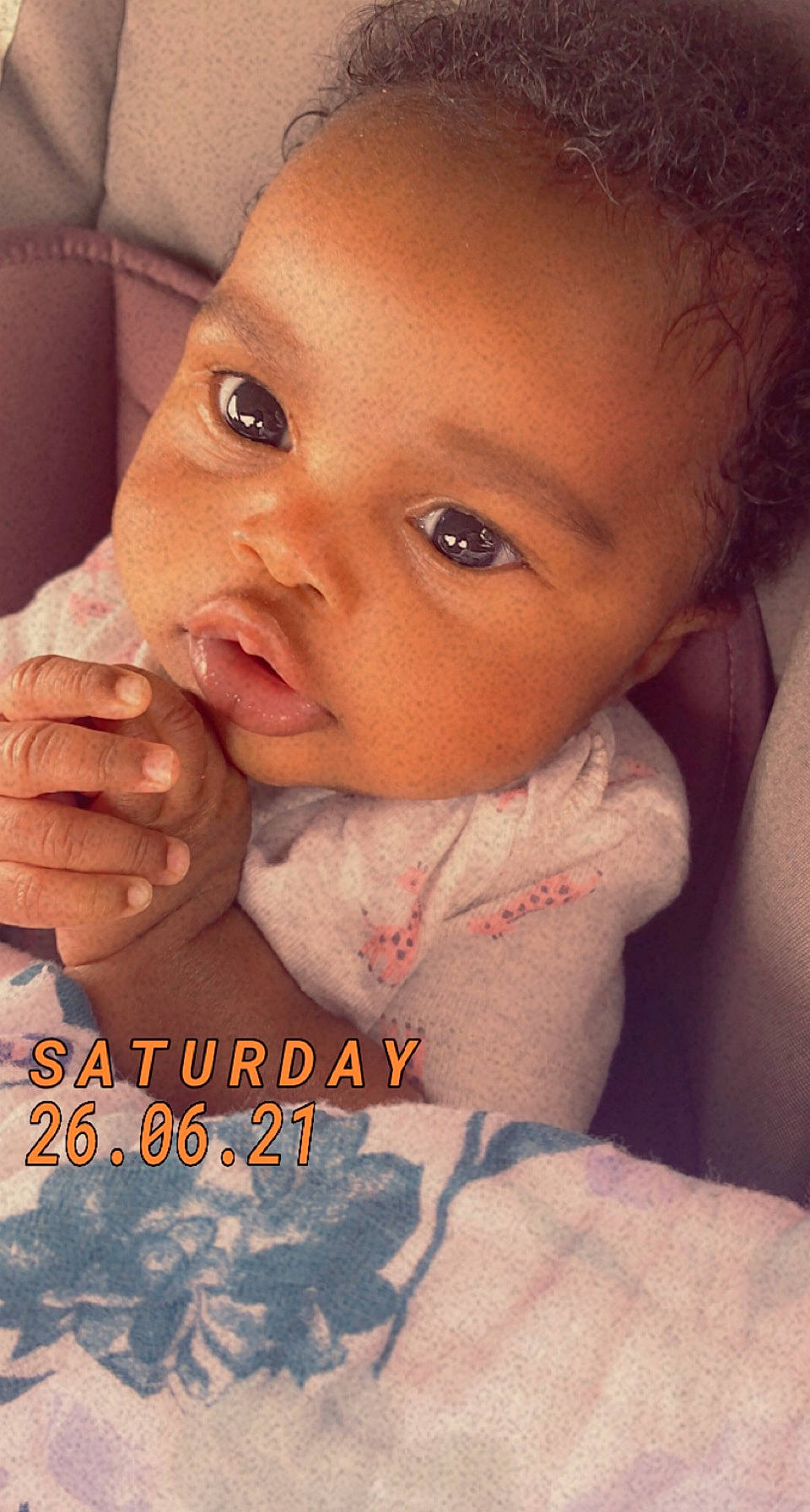 Zariyah is registered to the contest to win money with this photo: arm, baby_toddler_clothing, cheek, chin, ear, eye, eyebrow, eyelash, forehead, gesture, hand, happy, iris, jaw, lip, mouth, neck, nose, person, skin