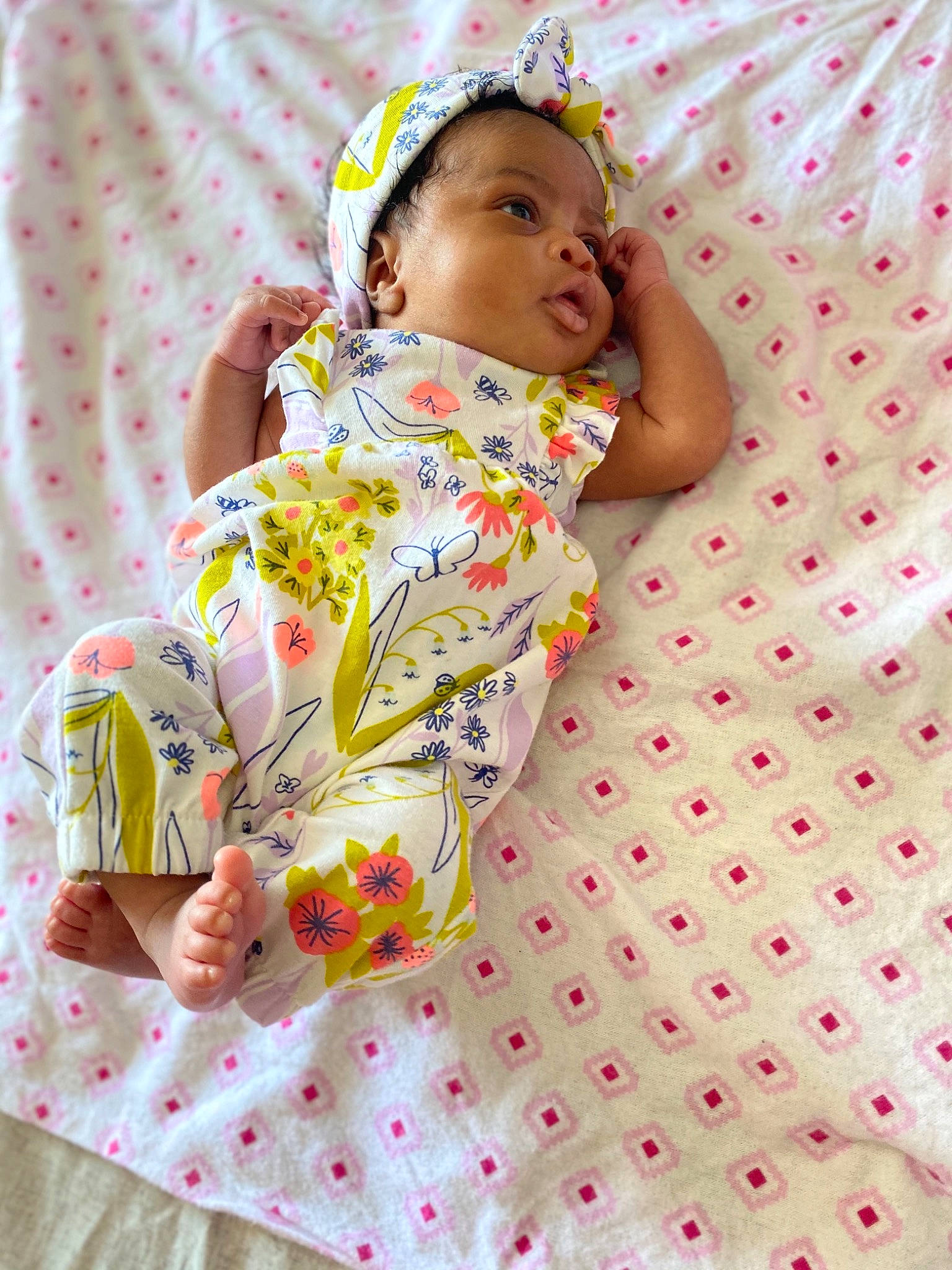 Zariyah is registered to the contest to win money with this photo: baby, baby_products, baby_safety, baby_toddler_clothing, bed_sheet, bedding, child, comfort, face, fun, happy, head, linens, pattern, person, pink, room, skin, sleeve, textile
