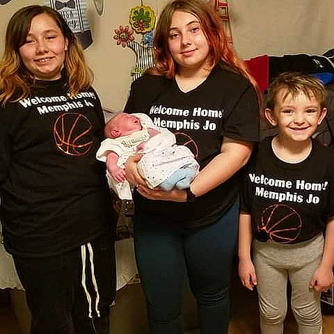 Sheldon is registered to the contest to win money with this photo: child, clothing, event, eye, face, fun, hair, happy, head, jewellery, joy, organ, person, shoulder, sleeve, smile, standing, t_shirt, team, thigh