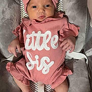 Sis joined the competition — help win amazing prizes! baby, infant, pink_outfit, headband, bow, baby_seat, cushion, cute, child, newborn, clothing, portrait, indoors, person, soft_texture, lying_down, looking, small_hands, footwear_none, baby_toy
