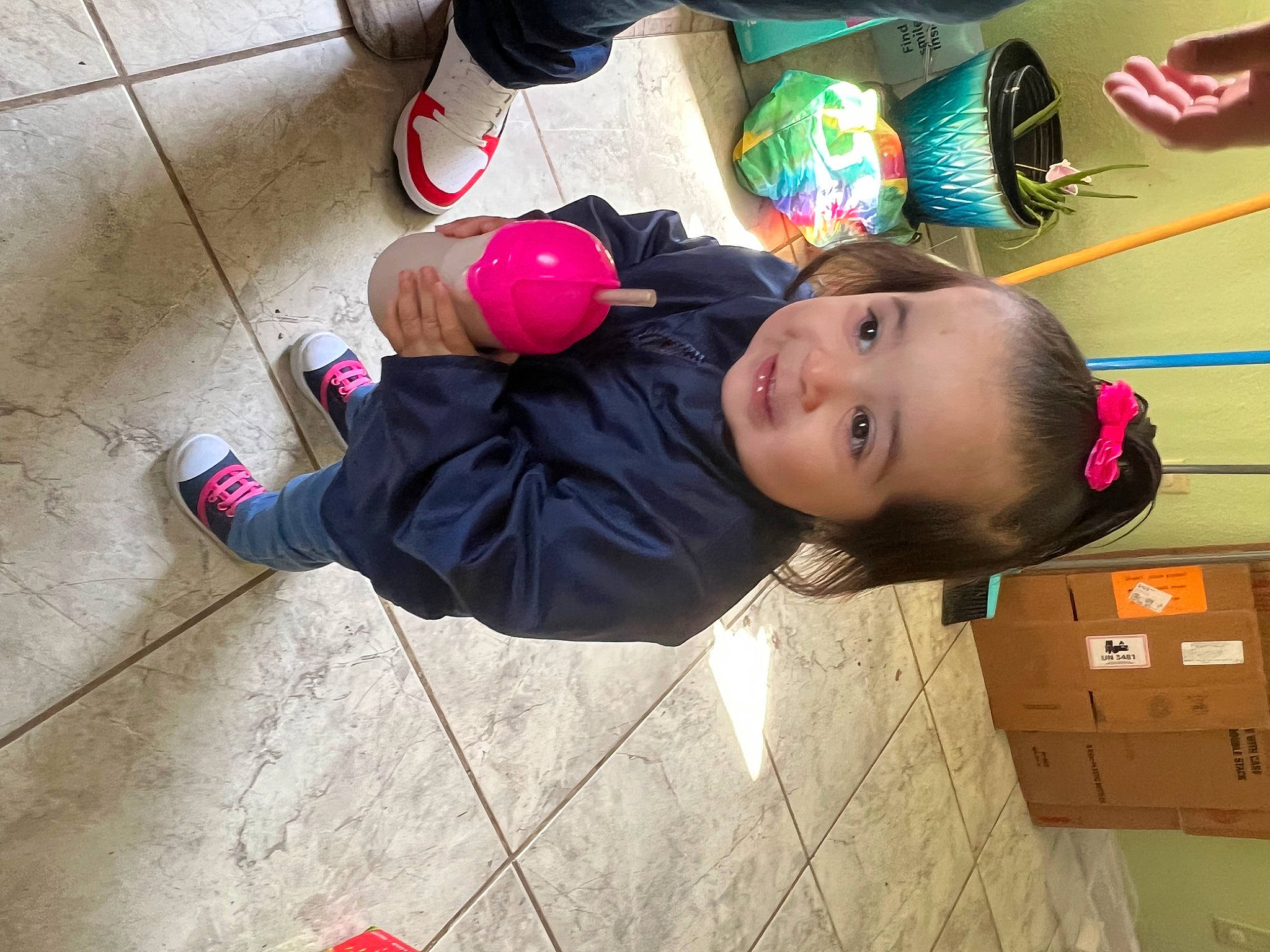 Analía is registered to the contest to win money with this photo: baby, baby_toddler_clothing, carton, cheek, child, flooring, foot, fun, happy, human_leg, joy, leisure, package_delivery, packing_materials, person, play, road_surface, shipping_box, sitting, smile