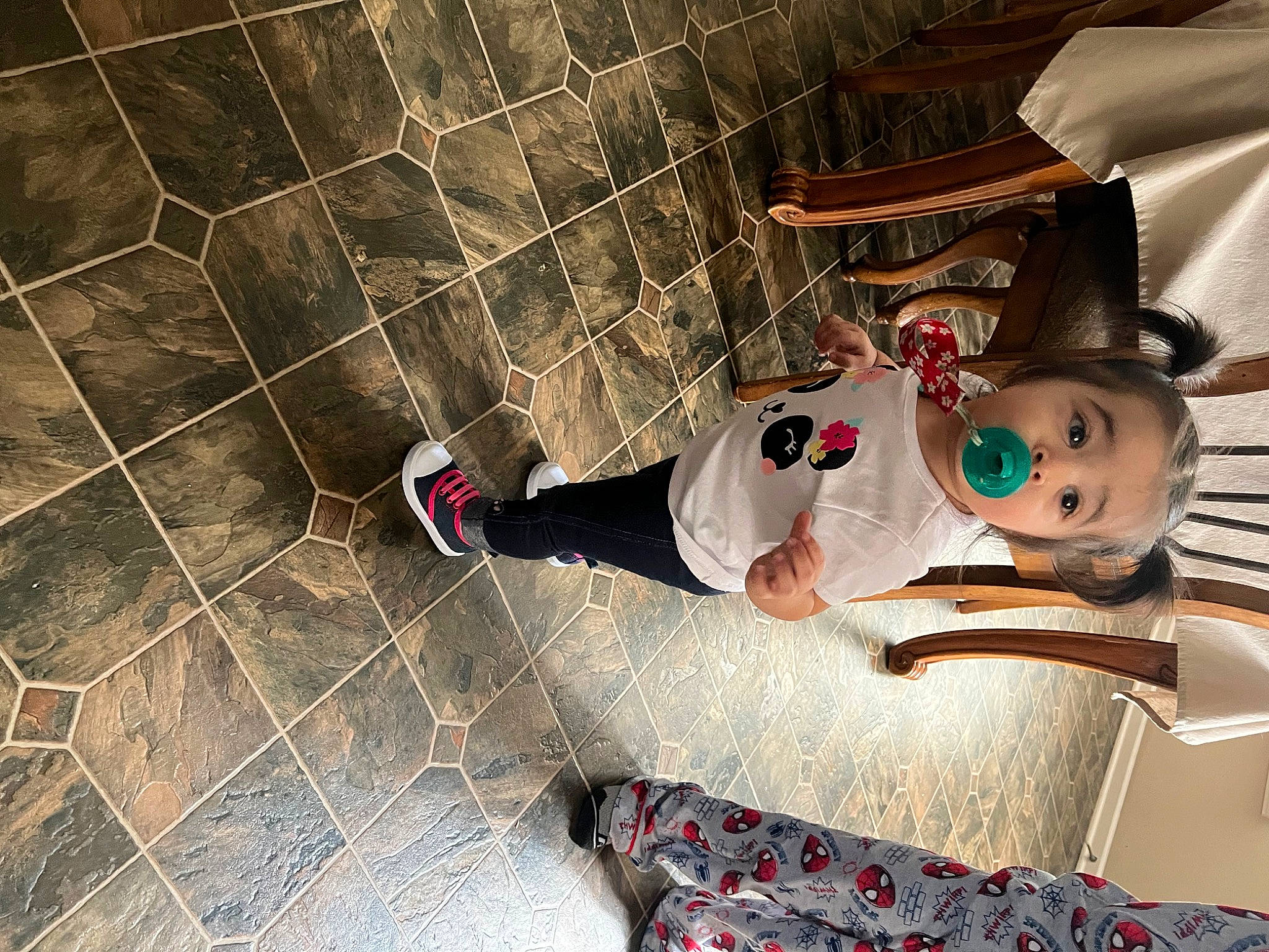 Analía is registered to the contest to win money with this photo: carmine, child, costume, doll, eyewear, flooring, fun, hat, leisure, pattern, person, road_surface, room, sandal, shadow, sitting, sunglasses, thigh, toy, tree