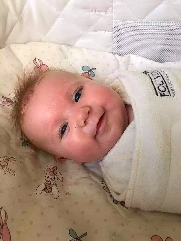 Nevaeh is registered to the contest to win money with this photo: baby, baby_safety, baby_toddler_clothing, cheek, chin, comfort, eye, eyebrow, face, happy, head, linens, lip, nose, person, skin, sleeve, smile, textile, toddler