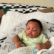 Haissam is registered to the contest to win money with this photo: baby, sleeping, pacifier, blanket, pillow, infant, cute, resting, indoors, child, soft, cozy, comfort, face, person, clothing, home, peaceful, expression, napping