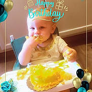Nelson joined the competition — help win amazing prizes! baby, birthday, cake, high_chair, food, smiling, celebration, party, decorations, balloons, roses, yellow_cake, face, child, messy, smile, indoor, table, hands, young_child