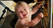 Nelson joined the competition — help win amazing prizes! baby, child, smile, stroller, infant, happy, indoor, person, cute, grabbing, seat, furniture, footwear, diaper, cheerful, young, human, portrait, playful, curious