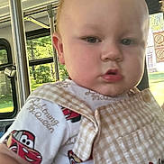 Nelson joined the competition — help win amazing prizes! baby, bus_interior, casual, child, close_up, clothing, cute, daylight, face, greenery, infant, lightning_mcqueen, overalls, portrait, seat, serious_expression, travel, vehicle, window, young_child