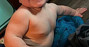 Nelson joined the competition — help win amazing prizes! baby, blanket, blue, child, chubby, cute, expression, floor, happy, home, indoor, infant, joyful, person, playful, shorts, sitting, skin, smile, young