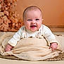 baby, smiling, happy, infant, blanket, beige, cute, portrait, child, toddler, soft, warm, cozy, indoor, clothing, face, hands, lying, cute_expression, background