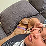 Ava is registered to the contest to win money with this photo: arm, brown_dog, casual_clothing, closeup, comfort, couch, dog, face, furniture, home, indoor, leisure, living_room, person, pillow, purple_collar, relaxing, resting, short_hair, snuggling