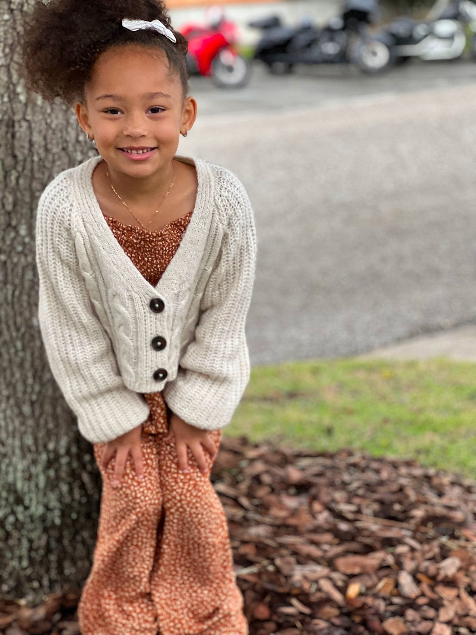 Jordan joined the competition — help win amazing prizes! child, dress, eye, face, flash_photography, grass, happy, headgear, jewellery, joy, neck, necklace, pattern, person, sitting, skin, sleeve, smile, soil, toddler