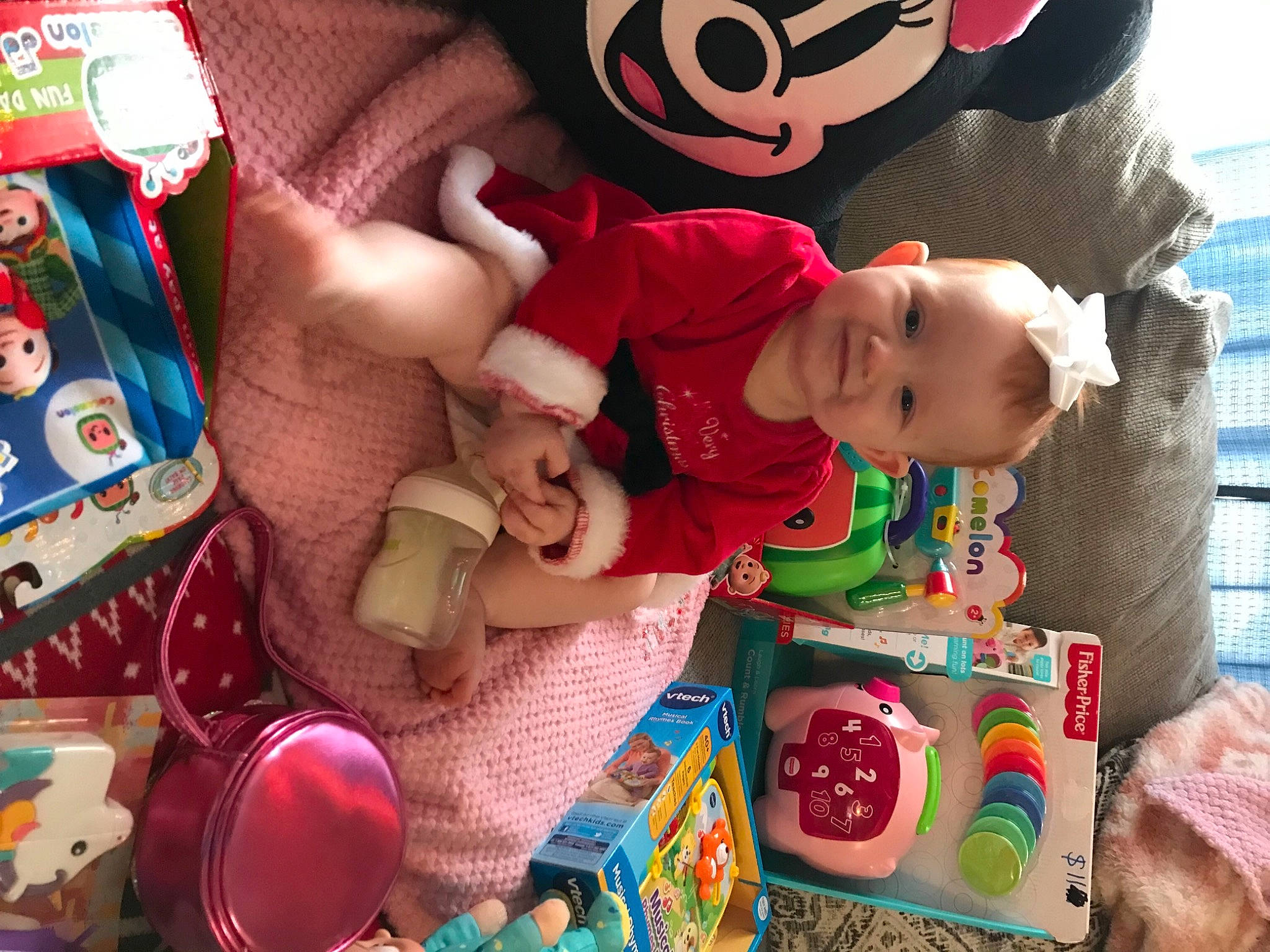 Zoey is registered to the contest to win money with this photo: baby, baby_toddler_clothing, beauty, child, event, fun, happy, joy, person, pink, play, product, red, room, skin, sleeve, snapshot, stuffed_toy, sweetness, textile