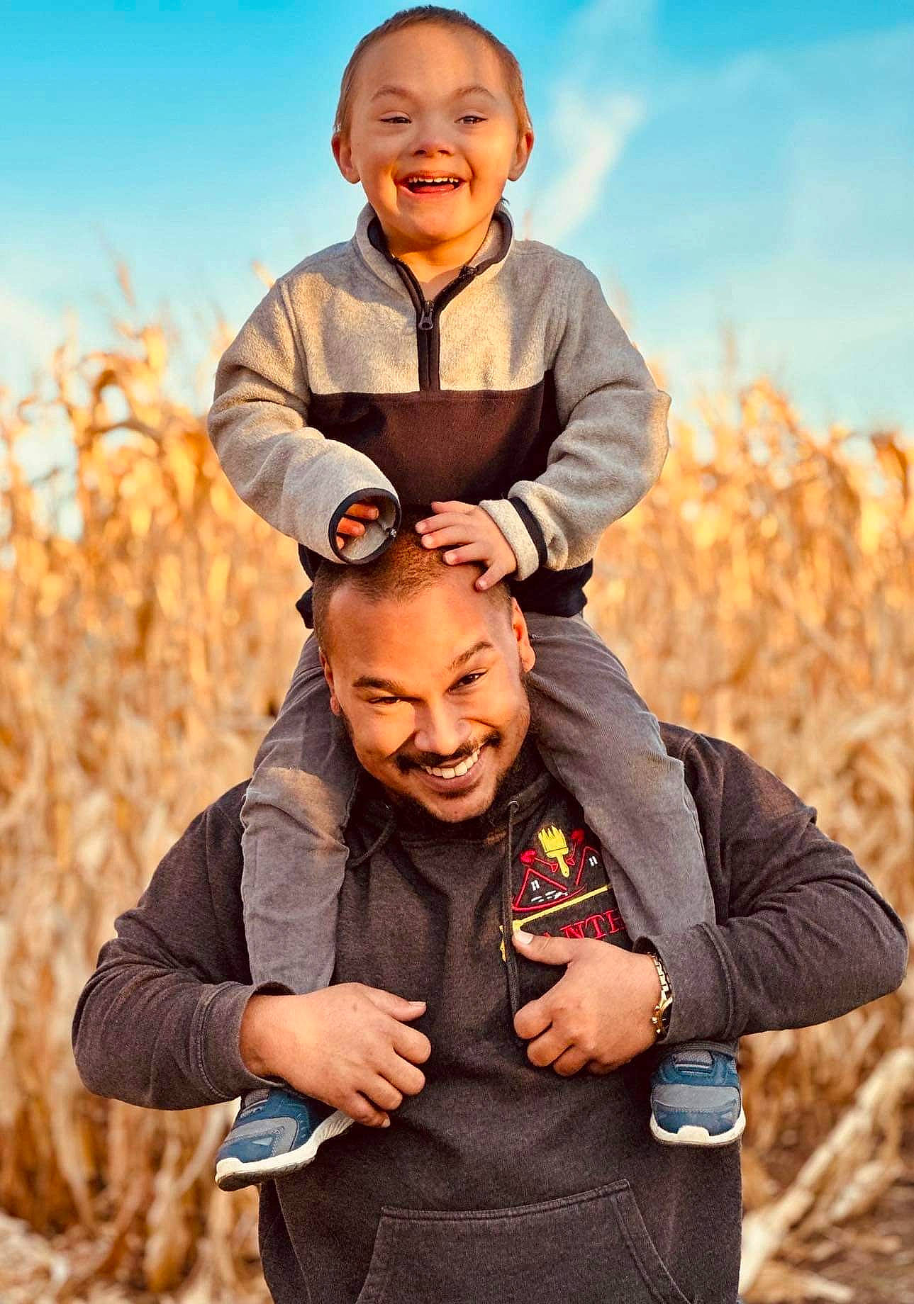 Jameson is registered to the contest to win money with this photo: arm, cloud, facial_expression, finger, flash_photography, fun, gesture, grass, grassland, hand, happy, joy, landscape, leisure, outerwear, people, people_in_nature, person, plant, sky