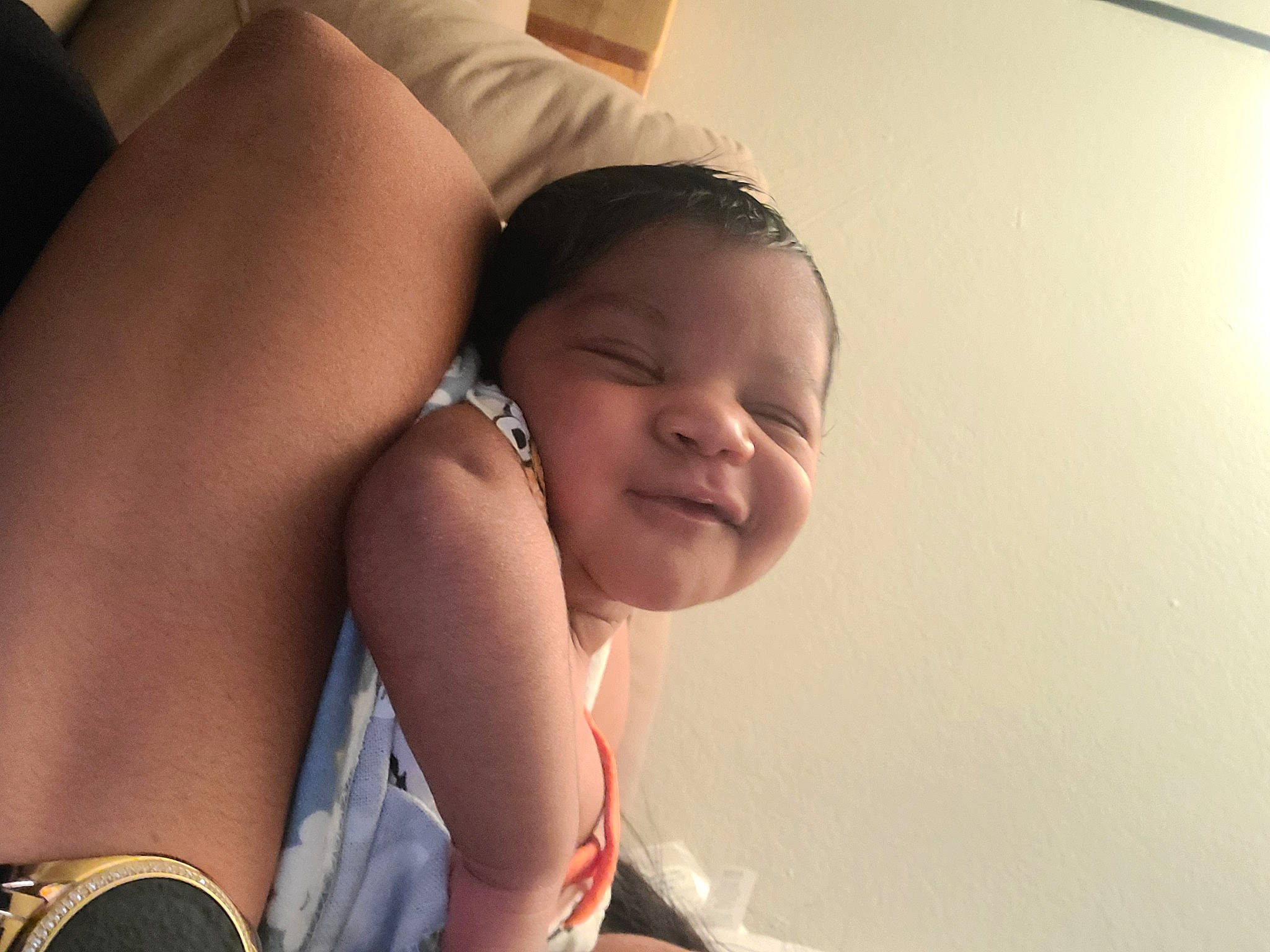 Keith is registered to the contest to win money with this photo: arm, baby, comfort, eye, facial_expression, hair, hairstyle, hand, happy, head, human_body, joint, leg, mouth, muscle, neck, person, shoulder, skin, smile