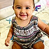 Shiloh William joined the competition — help win amazing prizes! baby, child, smiling, sitting, indoor, play_mat, patterned_clothing, denim_shorts, cute, happy, infant, portrait, young_child, toddler, face, person, skin, head, eyes, mouth