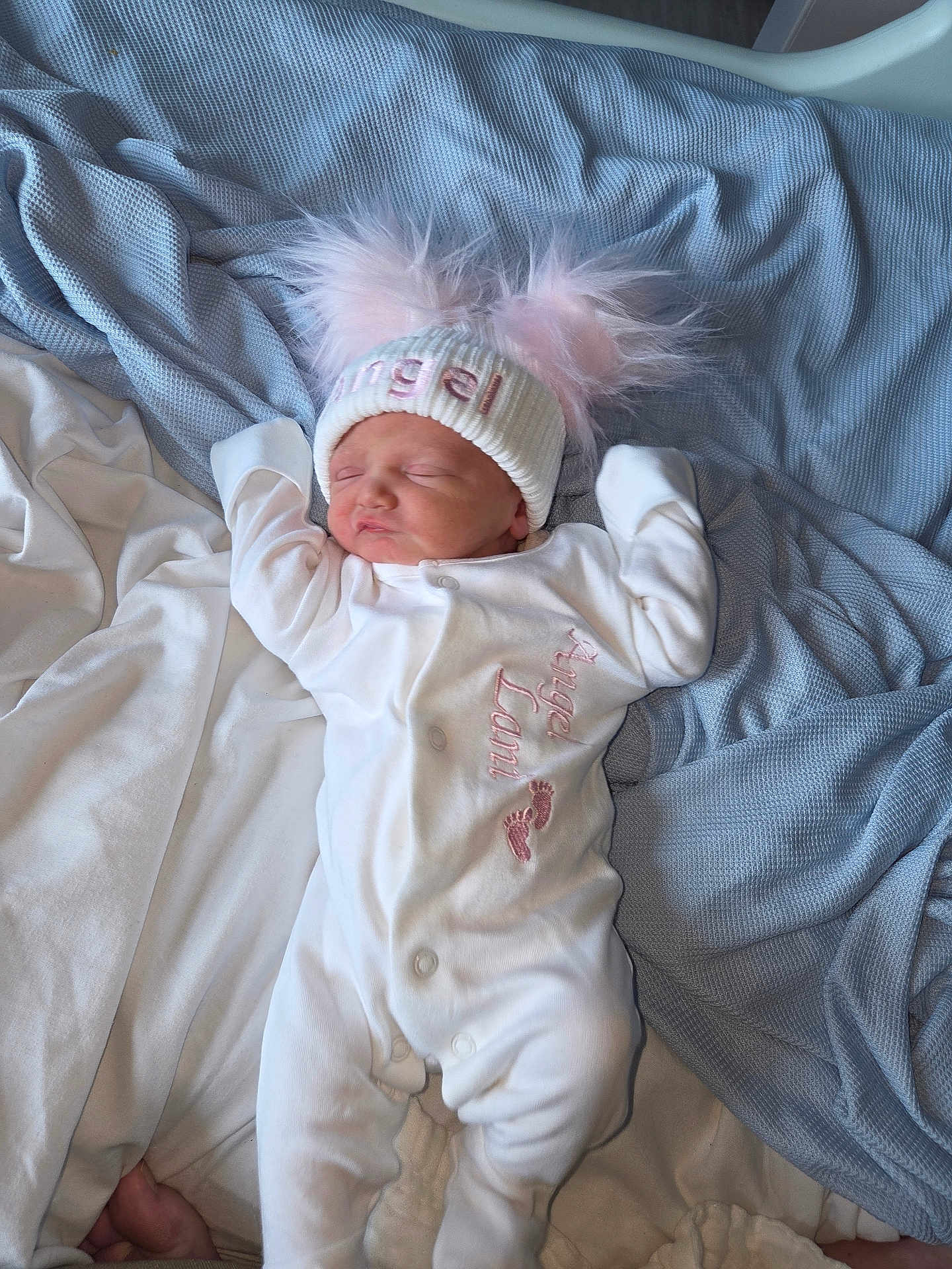 Angel joined the competition — help win amazing prizes! newborn, baby, sleeping, onesie, hat, pink_pom_poms, blanket, bed, cozy, cute, infant, soft, white_clothing, lying_down, peaceful, indoors, portrait, child, headwear, sleep