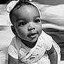 Isabella is registered to the contest to win money with this photo: baby, child, tutu, headband, bow, crawling, black_and_white, portrait, cute, infant, smiling, close_up, clothing, toddler, person, indoors, face, happy, young, baby_girl