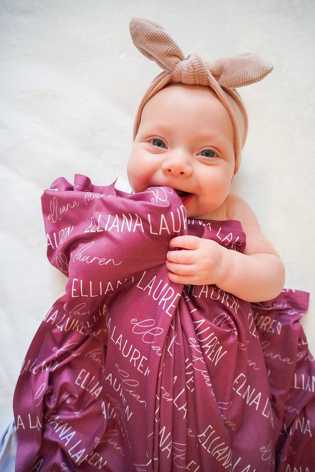 Elliana is registered to the contest to win money with this photo: baby_toddler_clothing, child, day_dress, embellishment, facial_expression, fashion_design, finger, happy, head, joy, magenta, one_piece_garment, pattern, person, pink, purple, skin, sleeve, smile, toddler