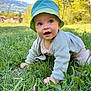 baby, child, grass, outdoor, nature, hat, crawling, greenery, trees, mountains, sky, sunlight, sweater, cute, happy, person, infant, portrait, spring, daytime