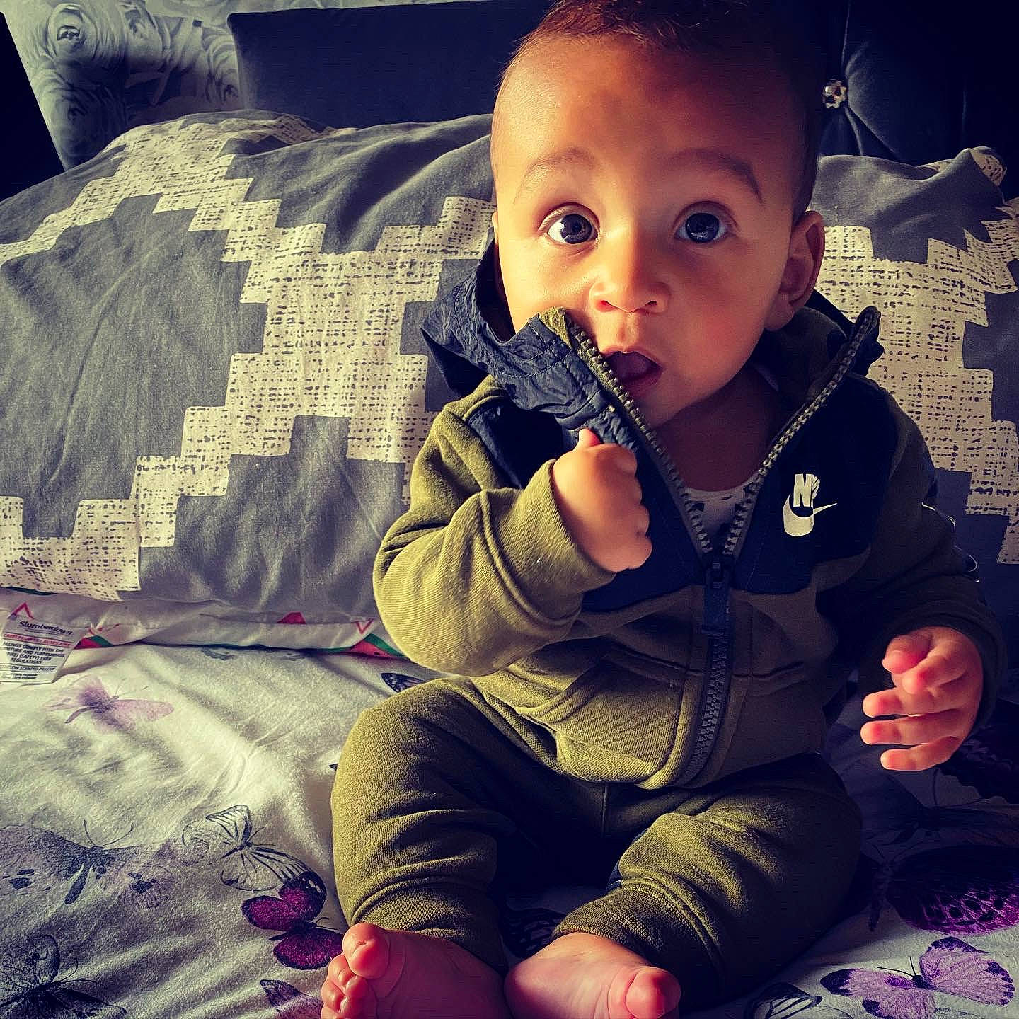 Manny joined the competition — help win amazing prizes! baby, cheek, child, cloud, cool, eye, face, finger, head, human, mountain, mouth, nose, outerwear, person, photography, play, selfie, sitting, sleeve