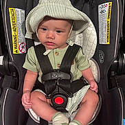Briar joined the competition — help win amazing prizes! baby, child, car_seat, seatbelt, hat, striped, green_clothing, socks, infant, serious_expression, safety, child_safety, indoor, portrait, cute, young_child, baby_boy, car_seat_warning, clothing, headwear