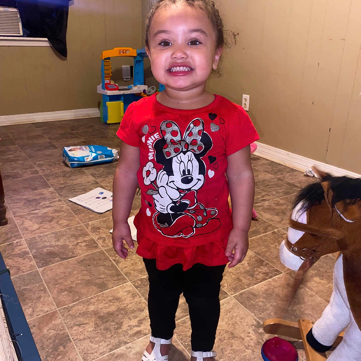 Isabella is registered to the contest to win money with this photo: ball, child, clothing, face, female, football, footwear, girl, head, indoors, pants, person, photography, portrait, shoe, shorts, soccer, soccerball, sport, t_shirt