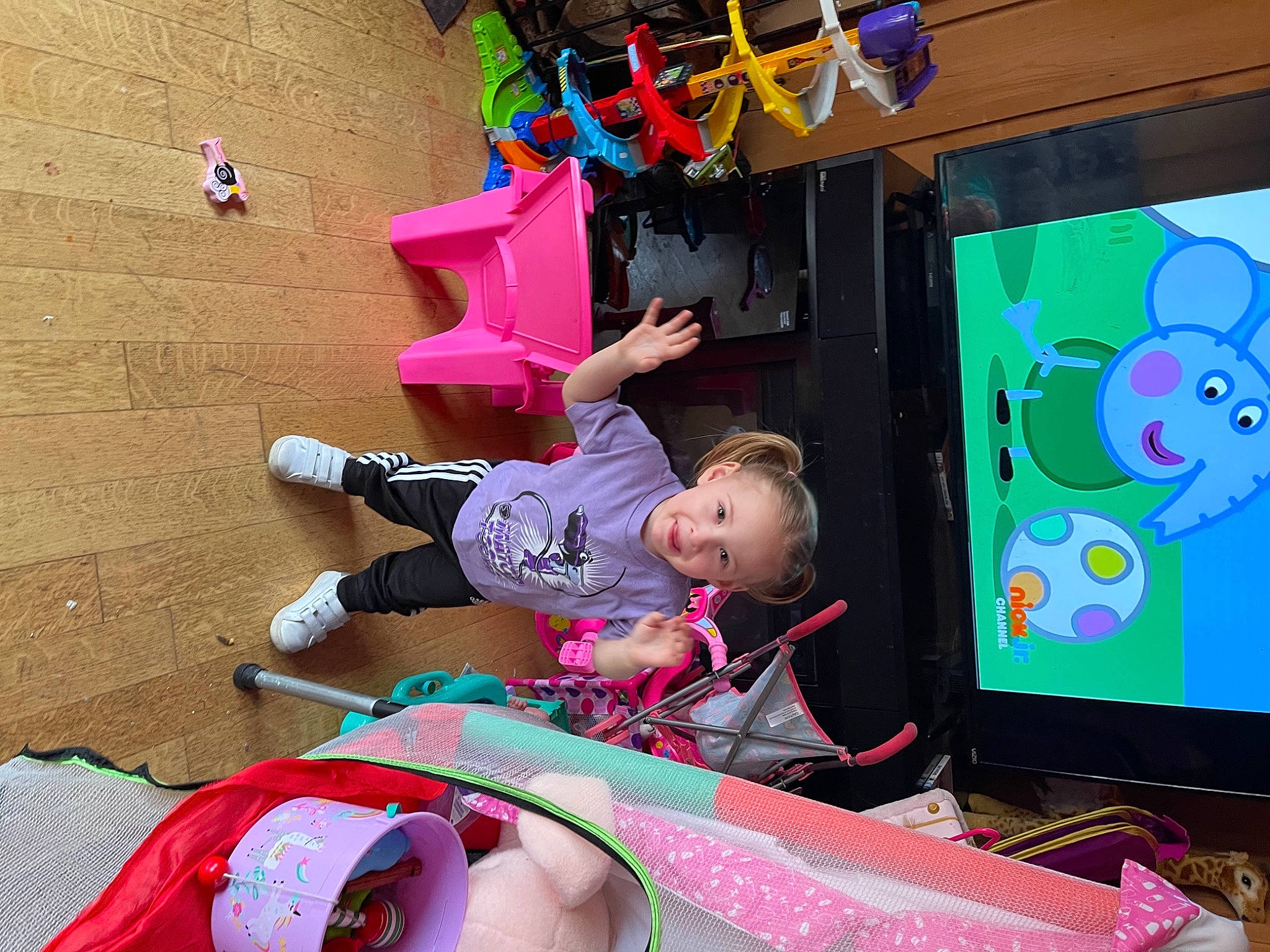 Aryah joined the competition — help win amazing prizes! art, baby, child, display_device, fun, green, happy, joy, leisure, magenta, person, pink, play, purple, recreation, red, room, sandal, t_shirt, tire