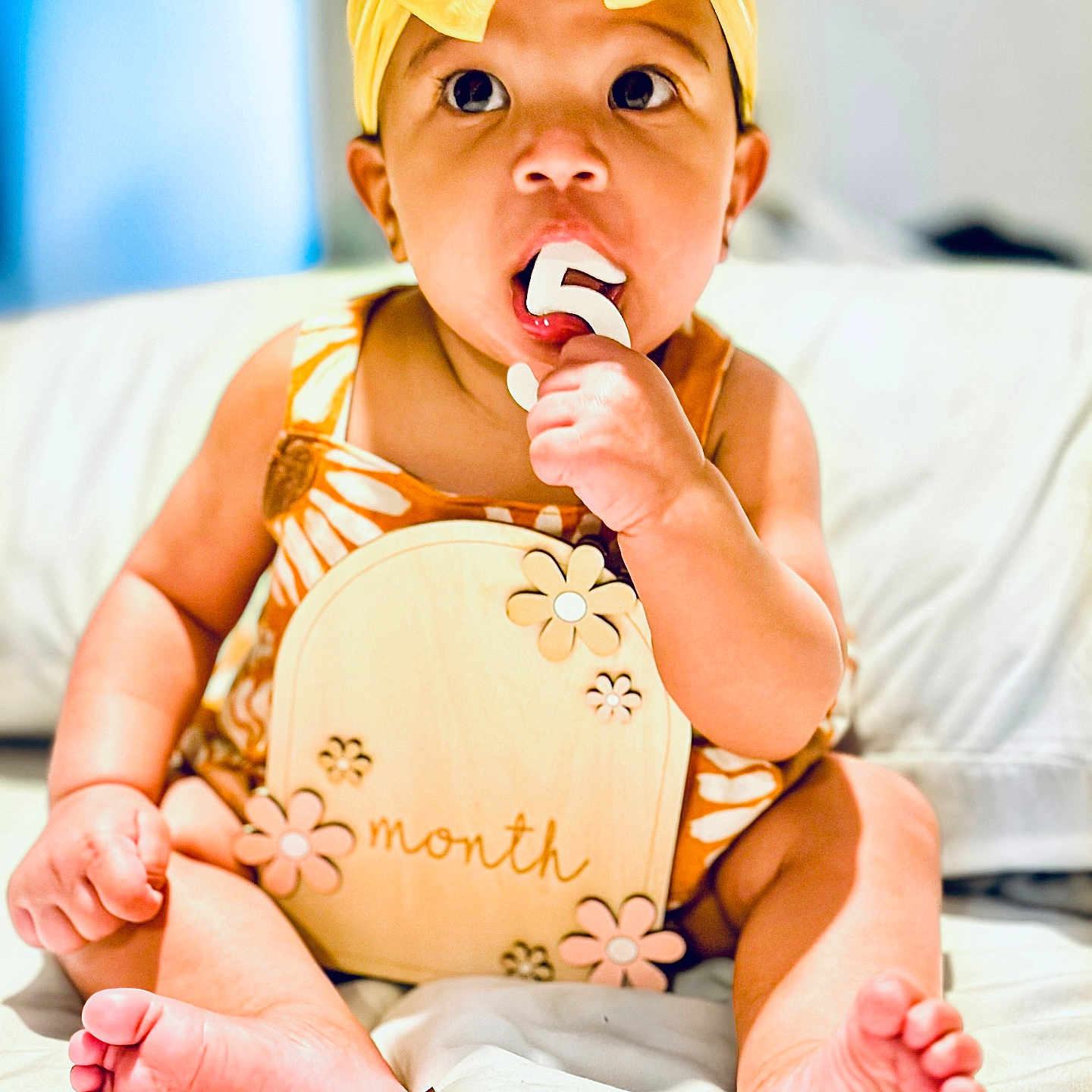 Amani joined the competition — help win amazing prizes! baby, bodypart, cap, clothing, couch, cream, dessert, eating, face, finger, food, furniture, hand, hat, head, icecream, person, photography, portrait, sweets