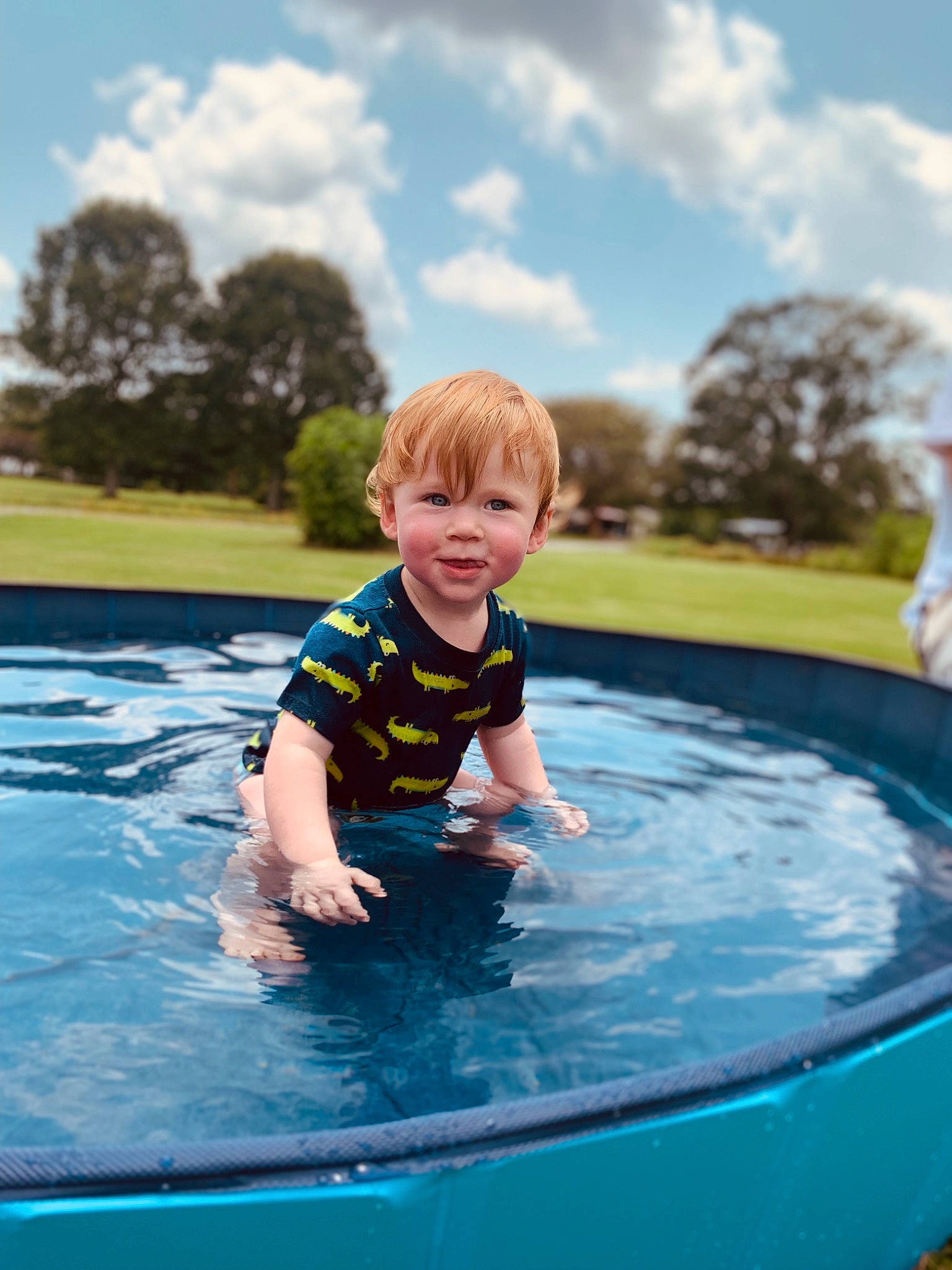 Kase is registered to the contest to win money with this photo: baby, bathing, child, cloud, electric_blue, fun, games, grass, happy, inflatable, joy, leisure, person, play, recreation, sky, smile, swimming_pool, toddler, tree