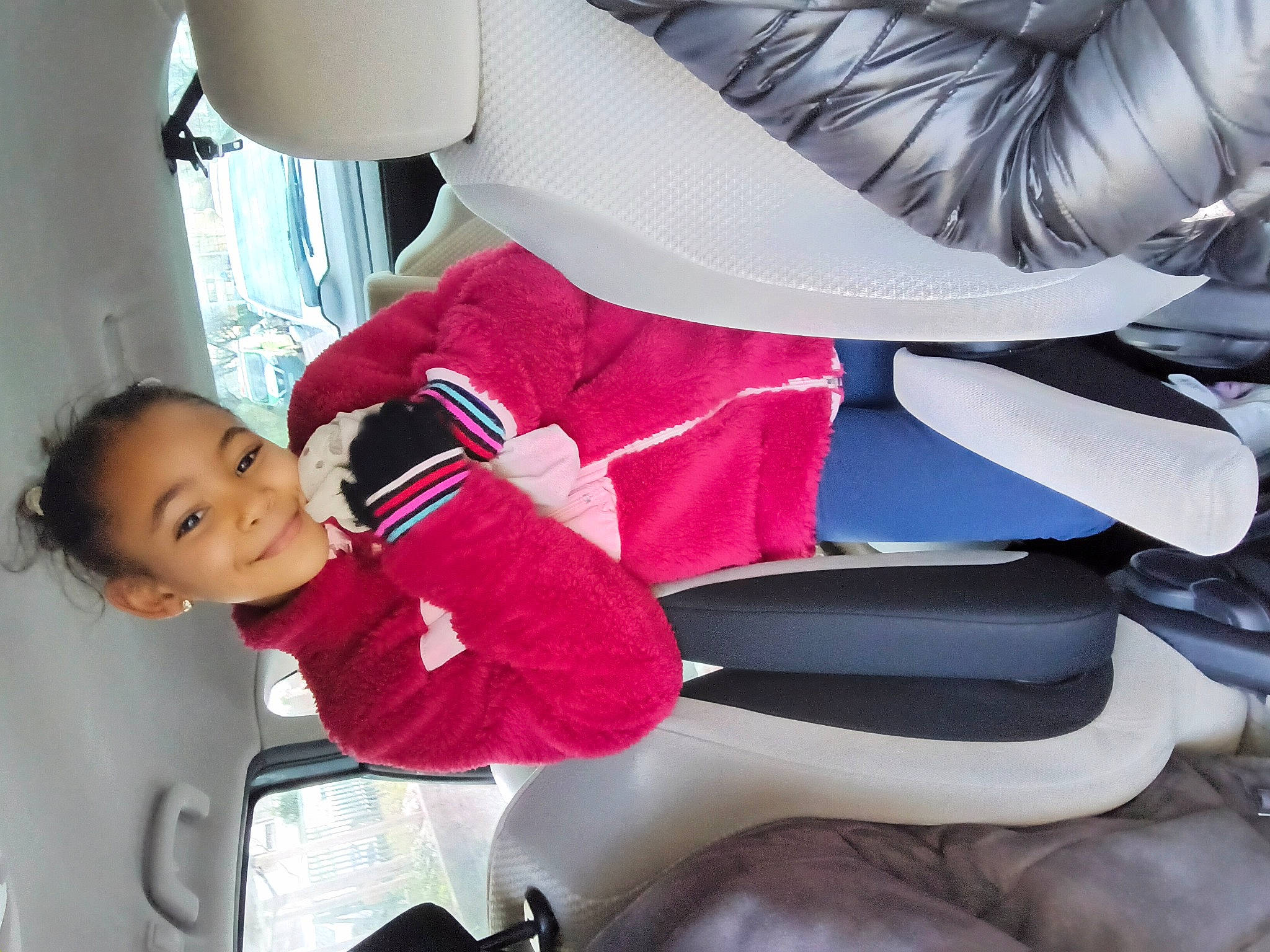 Jihane participe au concours pour gagner de l'argent avec cette photo : automotive_design, baby, carmine, child, comfort, fictional_character, fun, hat, human_leg, joy, lap, leisure, magenta, person, recreation, red, sitting, smile, suit, thigh