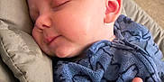 Luca joined the competition — help win amazing prizes! adorable, baby, blue_clothing, child, closeup, comfort, cushion, face, head, indoor, infant, onesie, peaceful, person, portrait, relaxing, resting, sleeping, soft_texture, young