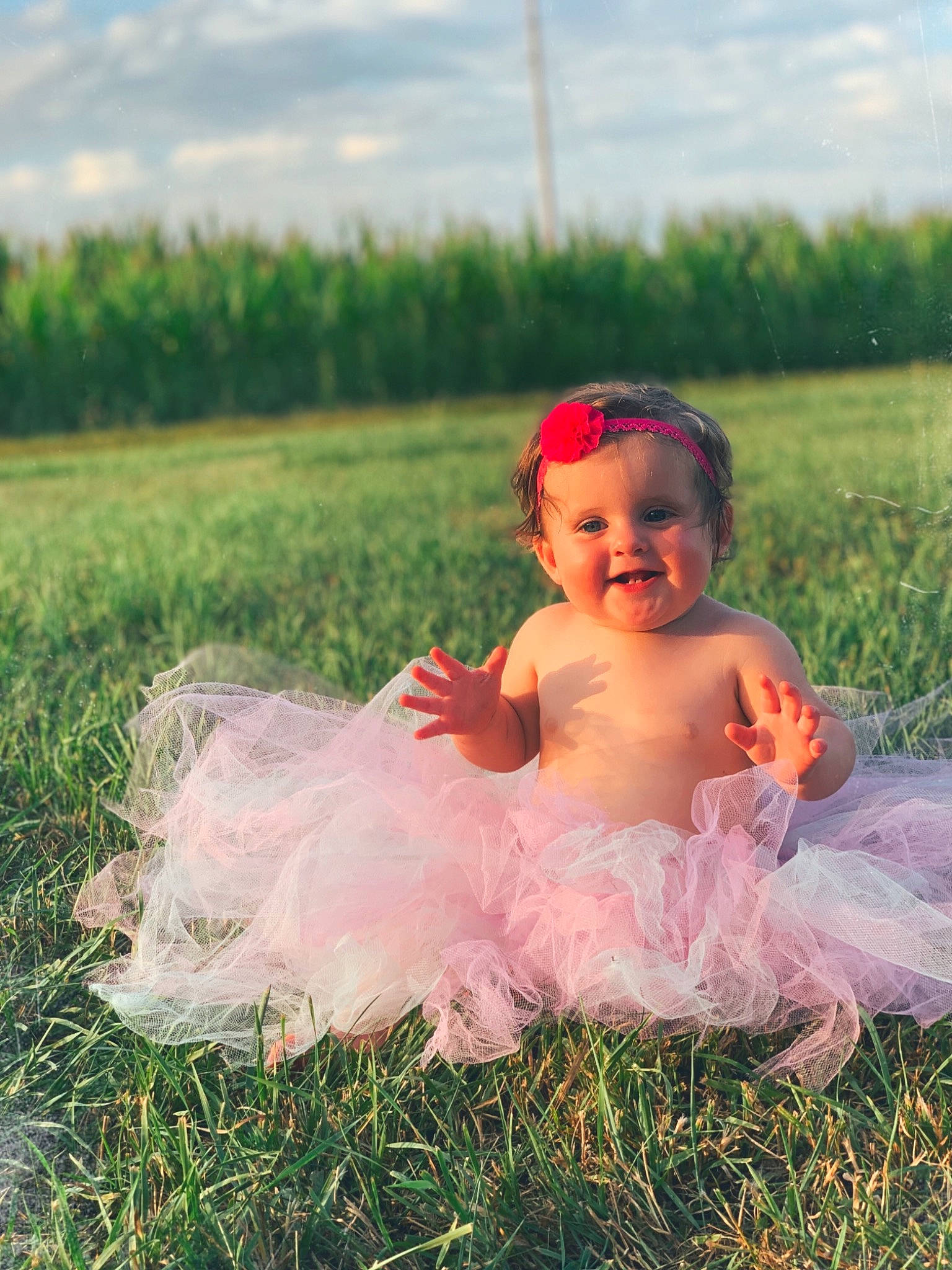Macie is registered to the contest to win money with this photo: baby, baby_toddler_clothing, ballet_tutu, child, costume, dress, fun, grass, grass_family, grassland, happy, joy, meadow, people_in_nature, person, photograph, photography, pink, plant, smile