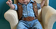 Wyatt joined the competition — help win amazing prizes! armchair, baby, belt, blue_background, boots, carpet, chair, child, costume, cowboy, cute, denim, fashion, hat, indoors, infant, portrait, smile, vest, western