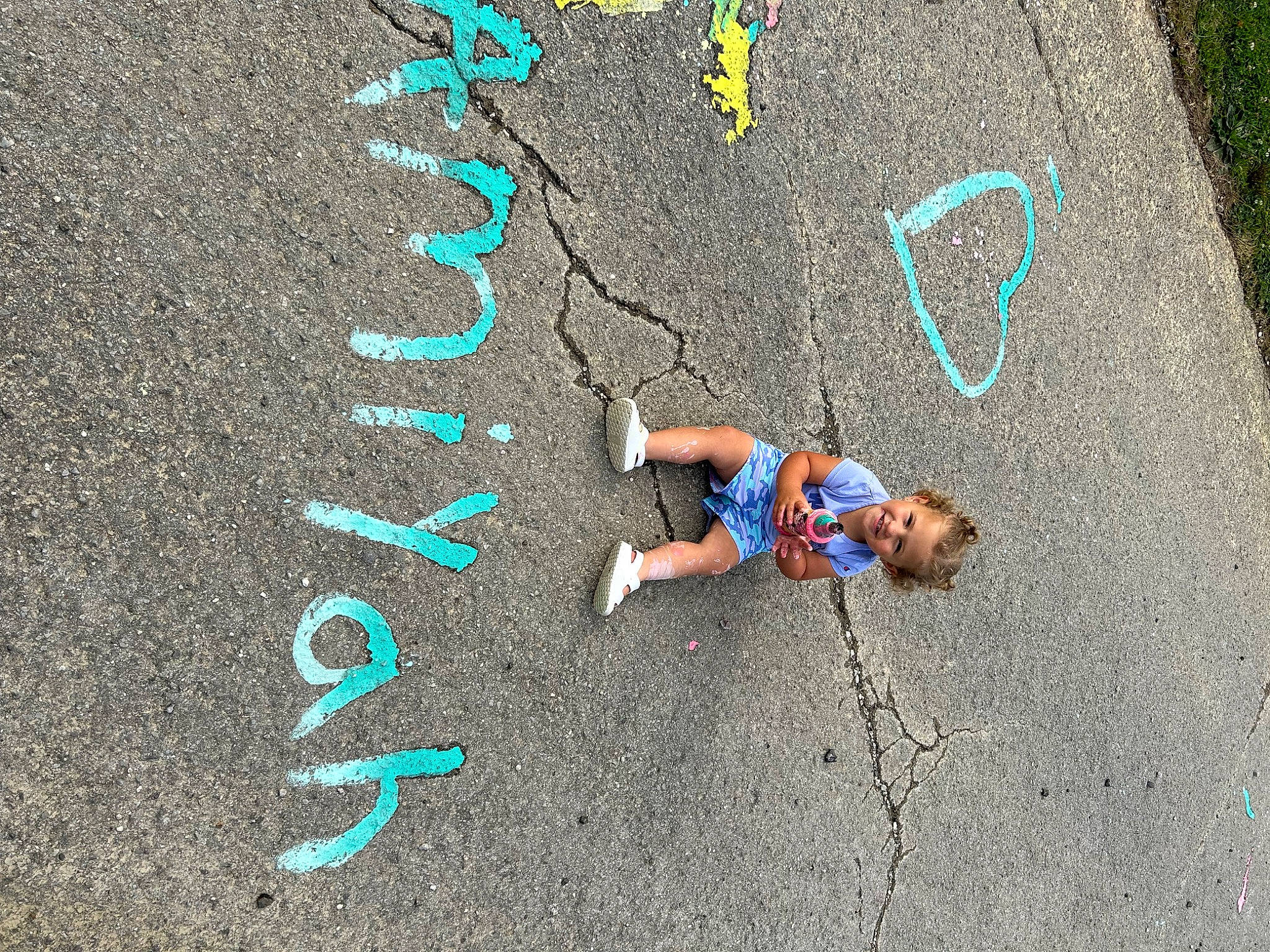 Amiyah is registered to the contest to win money with this photo: asphalt, chalk, city, concrete, electric_blue, font, fun, graphics, grass, handwriting, joy, number, person, road, road_surface, sand, shadow, sidewalk, soil, street