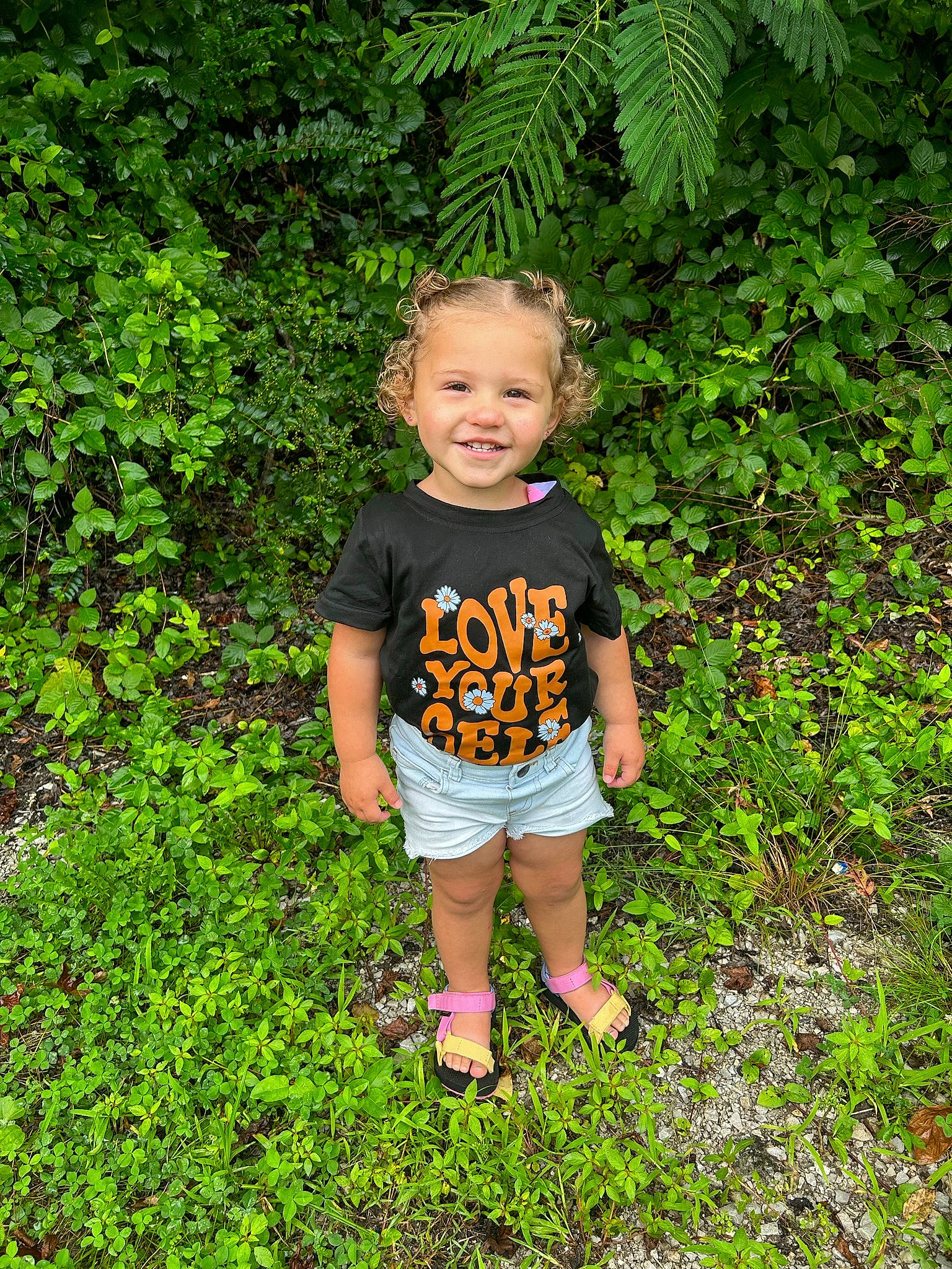Amiyah joined the competition — help win amazing prizes! baby_toddler_clothing, botany, grass, grass_family, green, groundcover, happy, joy, landscape, leaf, leisure, natural_landscape, people_in_nature, person, plant, shorts, shrub, smile, t_shirt, terrestrial_plant