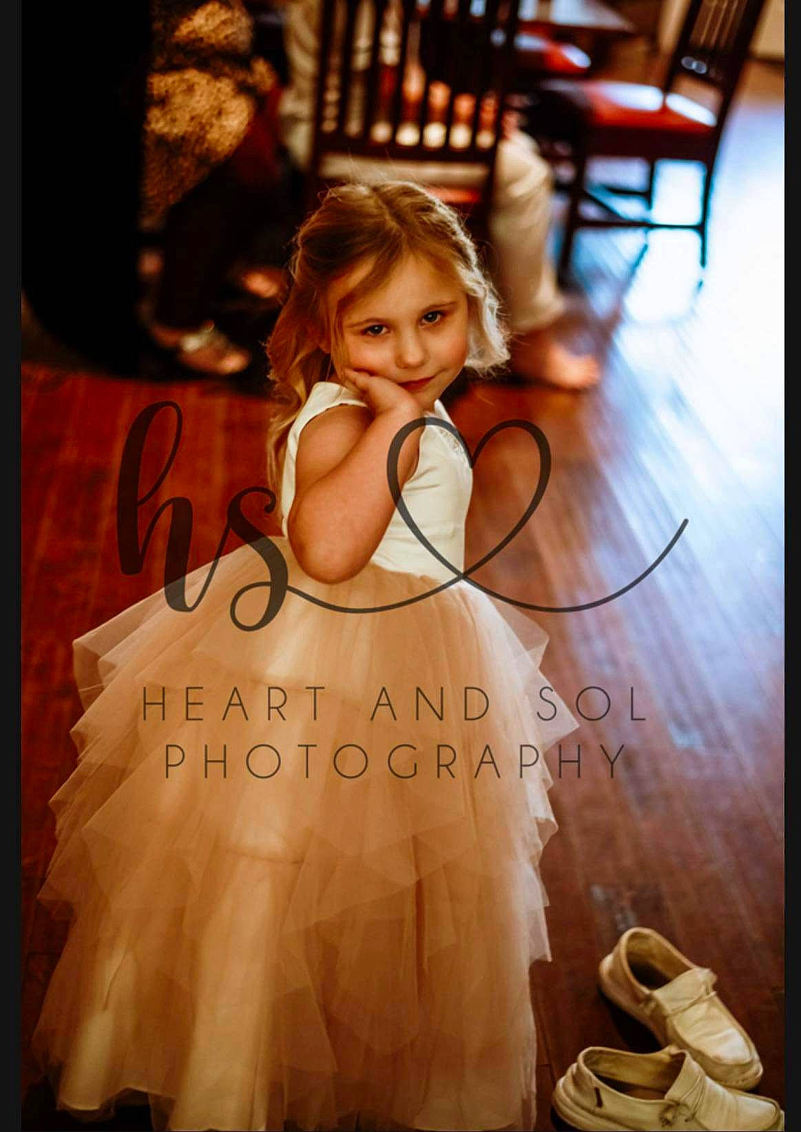 Kendall is registered to the contest to win money with this photo: bridal_clothing, bridal_party_dress, chair, dress, face, fashion_design, flash_photography, floor, flooring, formal_wear, gown, happy, lighting, person, shoulder, smile, toddler, wedding_ceremony_supply, wedding_dress, white