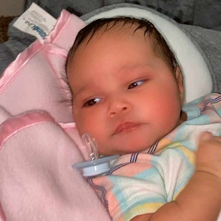 Lialah N Moore is registered to the contest to win money with this photo: architecture, baby, bed, blanket, bonnet, building, clothing, cushion, face, furniture, hat, head, homedecor, hospital, newborn, person, photography, portrait, sleeping, t_shirt