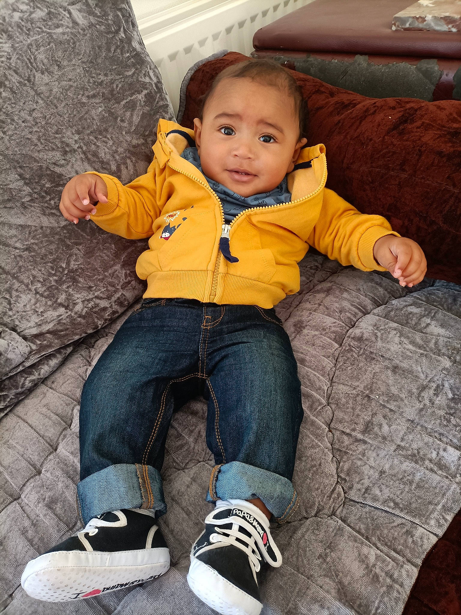 Sami participe au concours pour gagner de l'argent avec cette photo : baby_toddler_clothing, child, clothing, comfort, couch, eye, flooring, happy, jacket, lap, leg, person, photograph, shoe, sitting, sleeve, sneakers, sock, toddler, tree