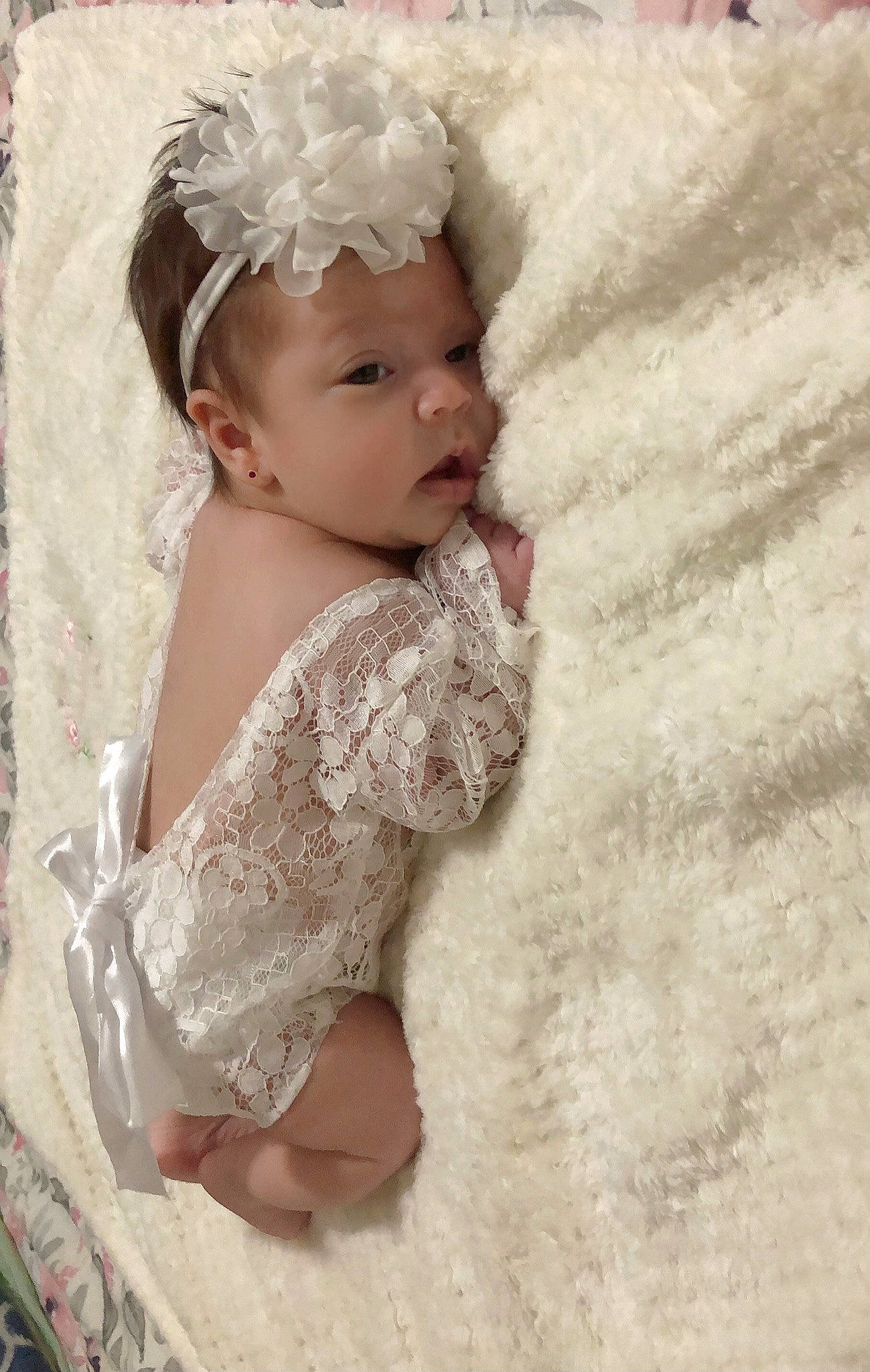 Jimena joined the competition — help win amazing prizes! baby, baby_toddler_clothing, bridal_accessory, child, dress, embellishment, face, fashion_accessory, flash_photography, hair_accessory, happy, headband, headgear, headpiece, headwear, iris, jewellery, person, petal, sitting