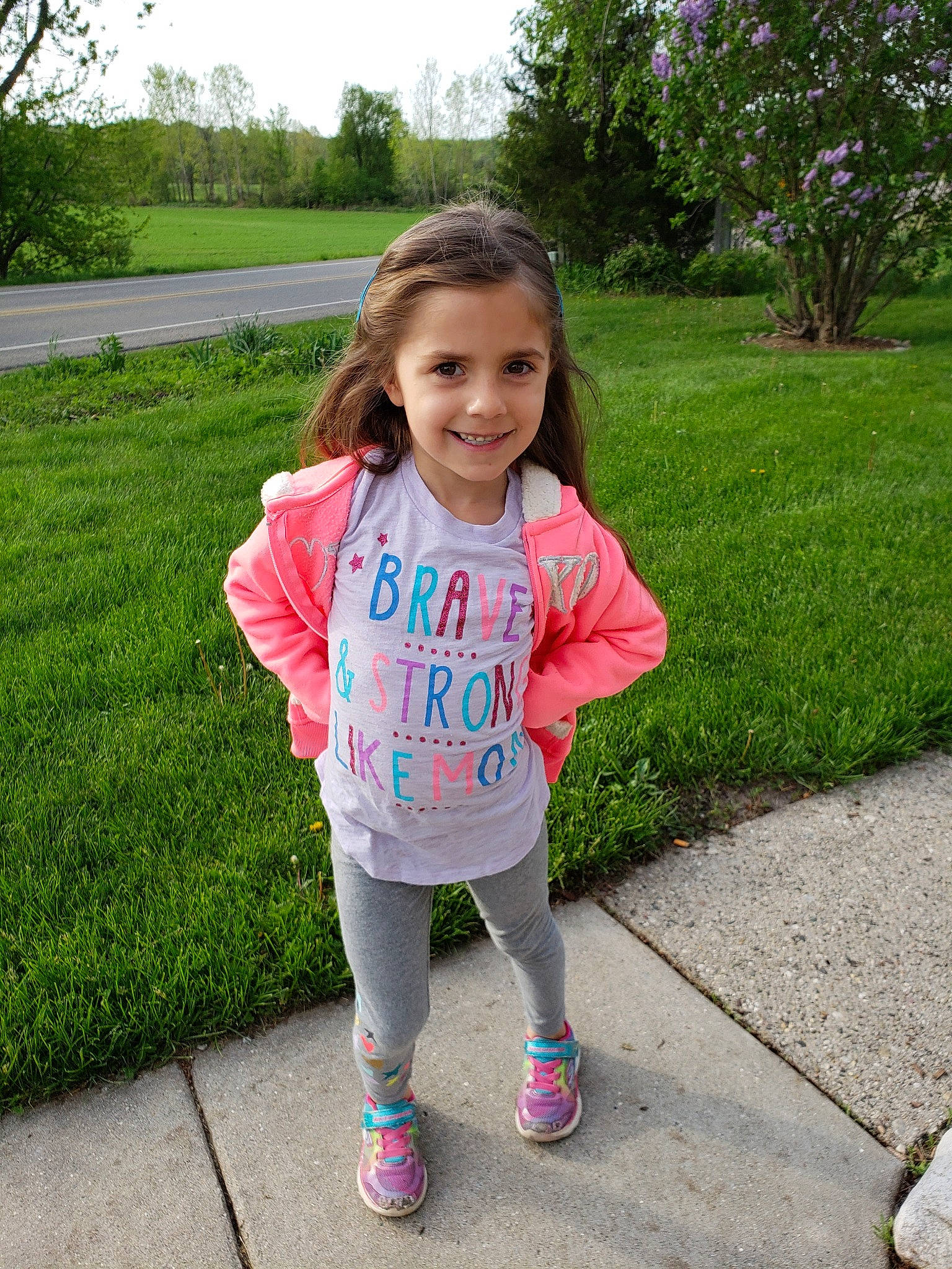 Cora Lee is registered to the contest to win money with this photo: child, grass, joy, leisure, outerwear, person, pink, plant, play, recreation, running, shoe, sleeve, smile, summer, t_shirt, toddler, walking