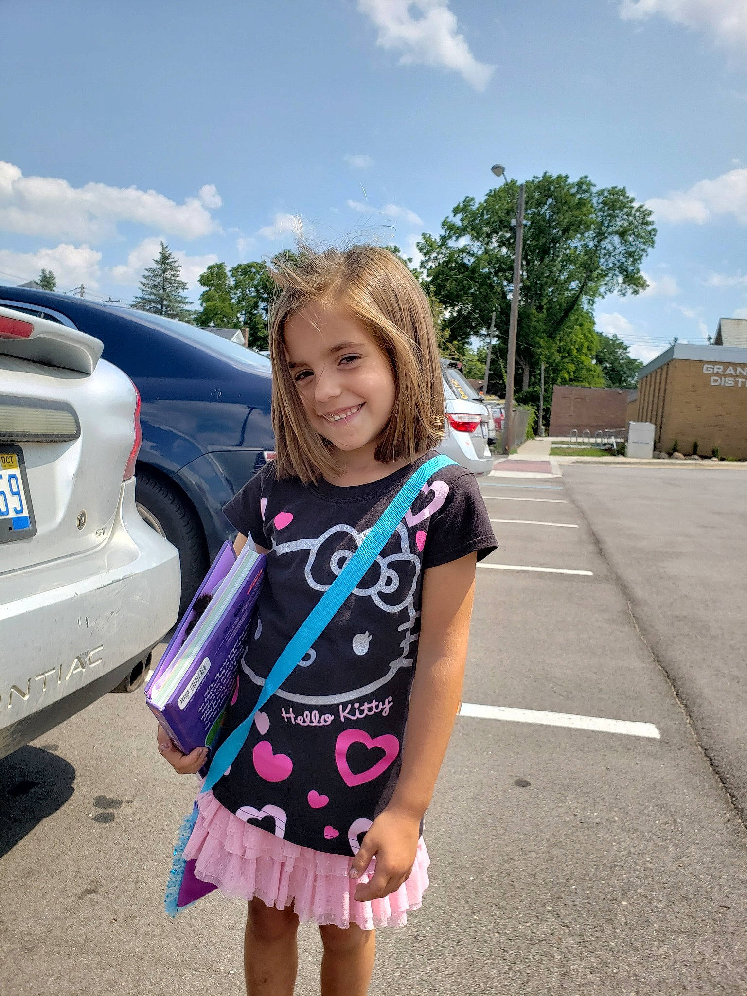 Cora Lee joined the competition — help win amazing prizes! automotive_exterior, blond, bumper, car, child, compact_car, cool, family_car, joy, luxury_vehicle, minivan, motor_vehicle, person, pink, road, smile, subcompact_car, summer, toddler, vacation