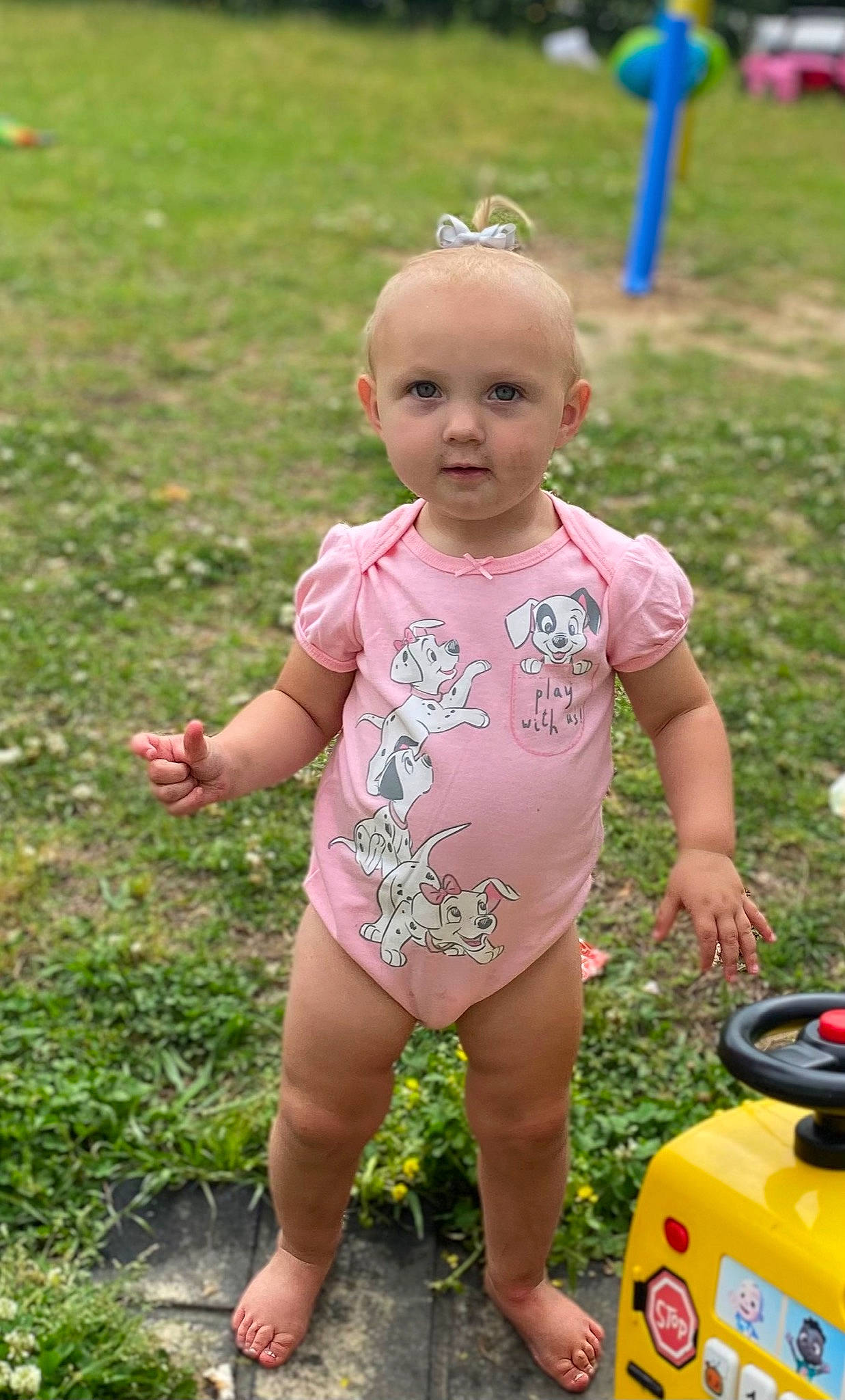 Kiley is registered to the contest to win money with this photo: baby, baby_toddler_clothing, child, fun, garden, grass, happy, leisure, people_in_nature, person, pink, plant, play, recreation, smile, summer, t_shirt, tire, toddler, toy