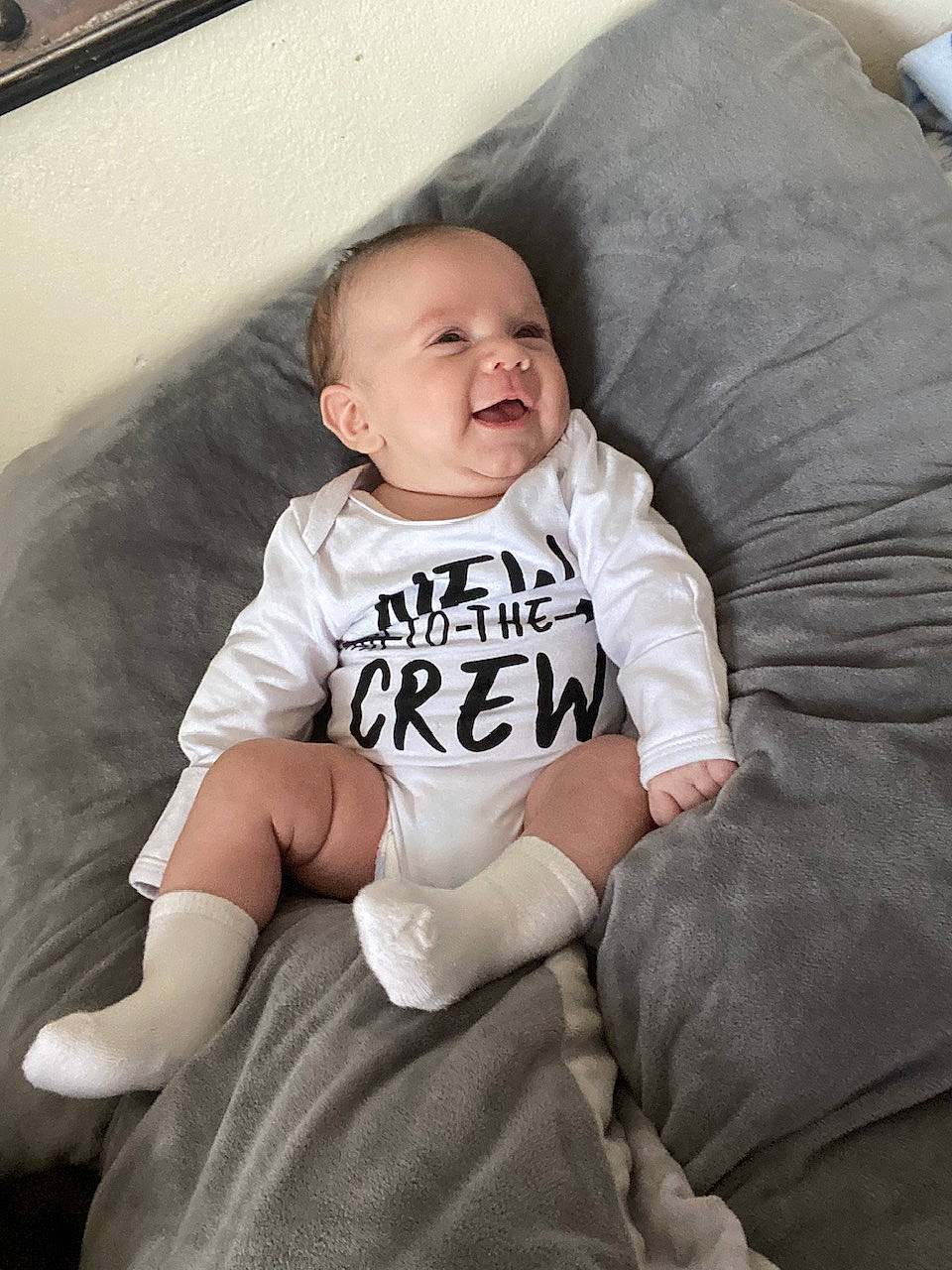Martel joined the competition — help win amazing prizes! baby, baby_toddler_clothing, child, comfort, couch, flash_photography, fun, happy, human_leg, knee, linens, pattern, person, sitting, sleeve, smile, sock, t_shirt, throw_pillow, toddler