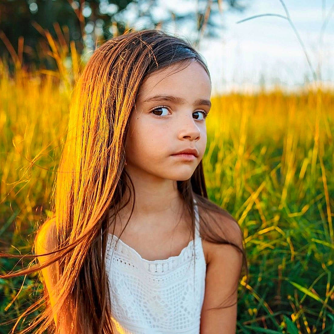 Kalli is registered to the contest to win money with this photo: beauty, brown_hair, child, child_model, eye, face, grass, grass_family, hair, hairstyle, lip, long_hair, people_in_nature, person, photography, portrait, portrait_photography, smile, summer, sunlight