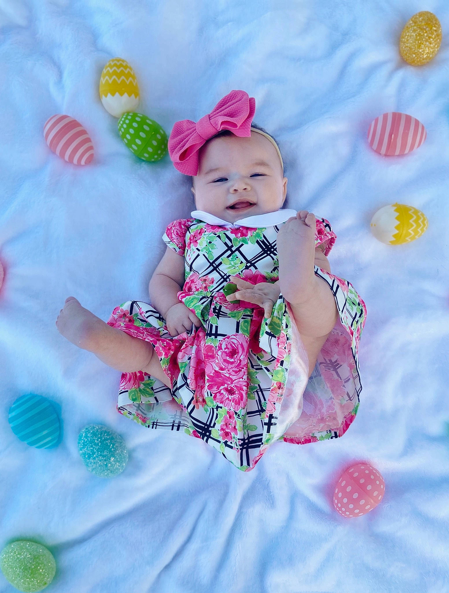 Laikyn is registered to the contest to win money with this photo: baby, baby_toddler_clothing, cap, child, dress, embellishment, face, fashion_accessory, fun, grass, happy, linens, magenta, pattern, person, pink, purple, sleeve, textile, toddler