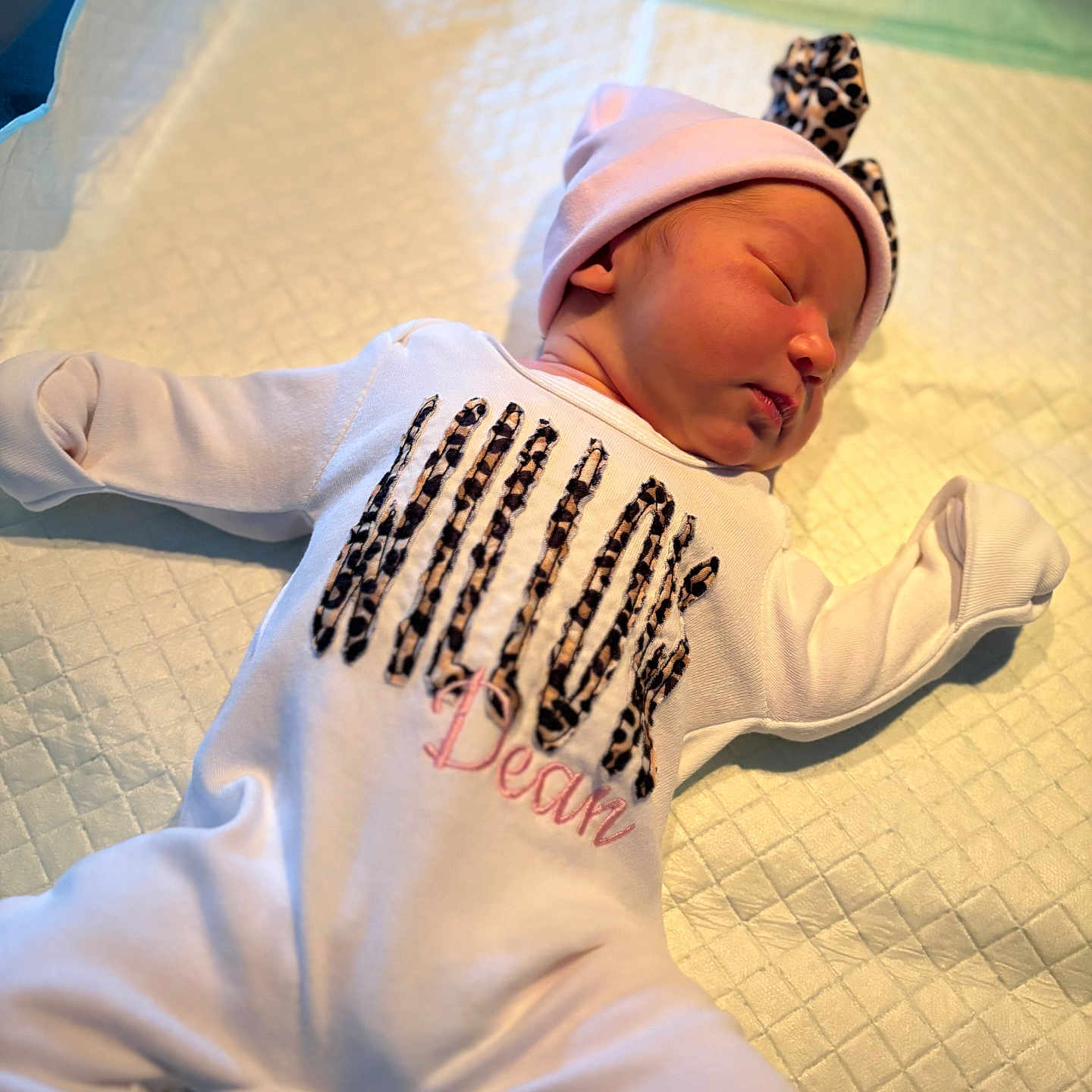 Willowdean is registered to the contest to win money with this photo: baby, blanket, changing_pad, cheeks, cute, hat, headband, hospital, infant, laying_down, leopard_print, newborn, nursery, onesie, pajamas, peaceful, portrait, sleeping, small_person, soft_lighting